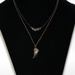 Layered one necklace with  star and wing charms hematite and gold chain